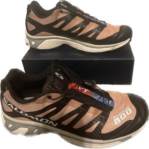 Salomon black and tan athletic shoes size 10.5